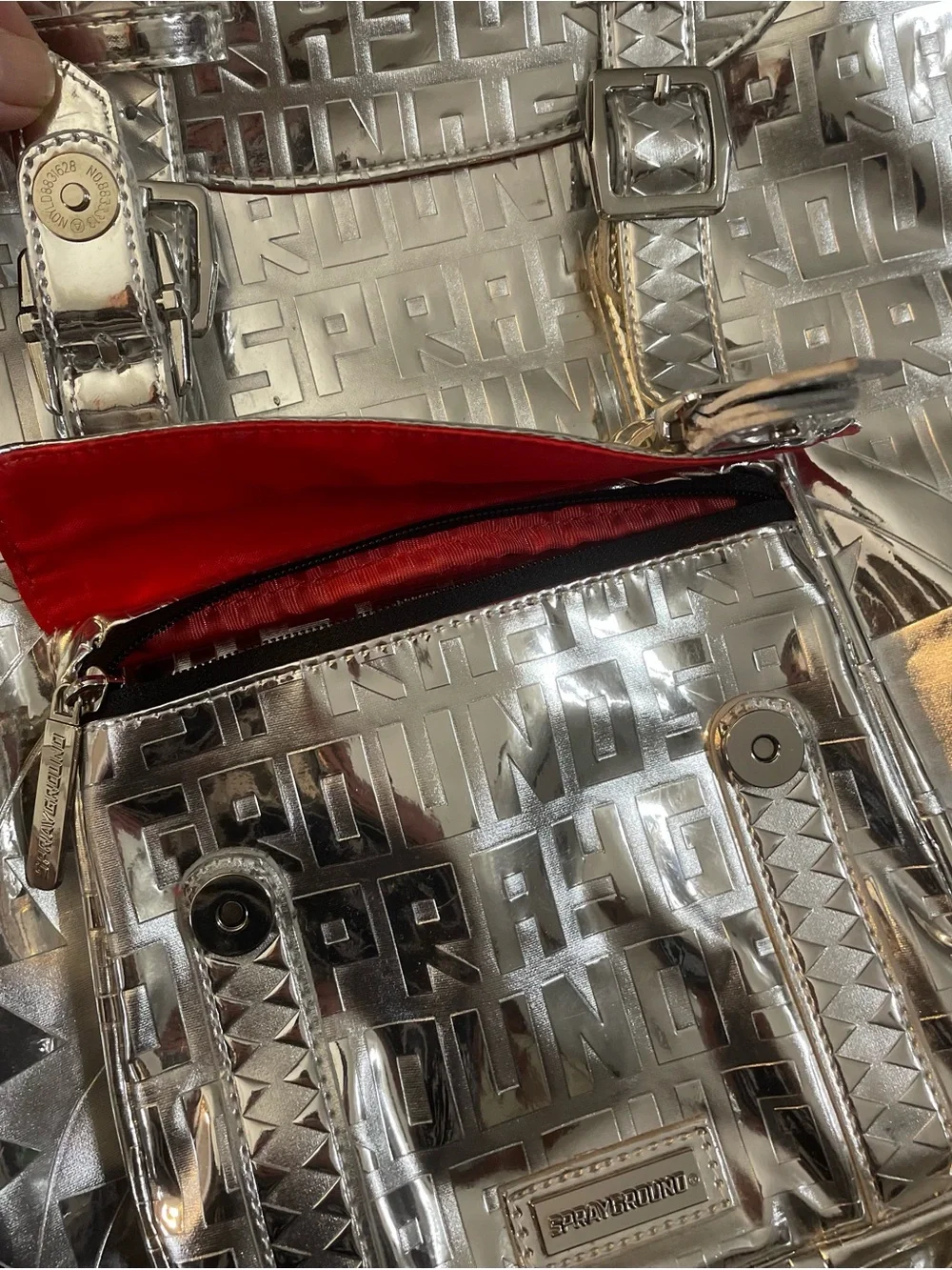 Sprayground Metallic Silver Logo Backpack with Red Accents